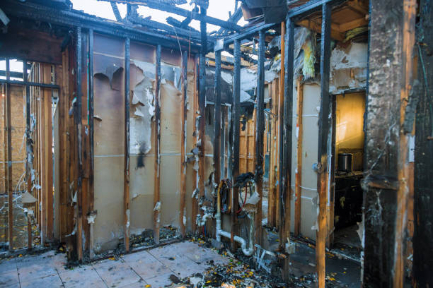Professional Fire Damage Restoration technician working in Lakes West, CT